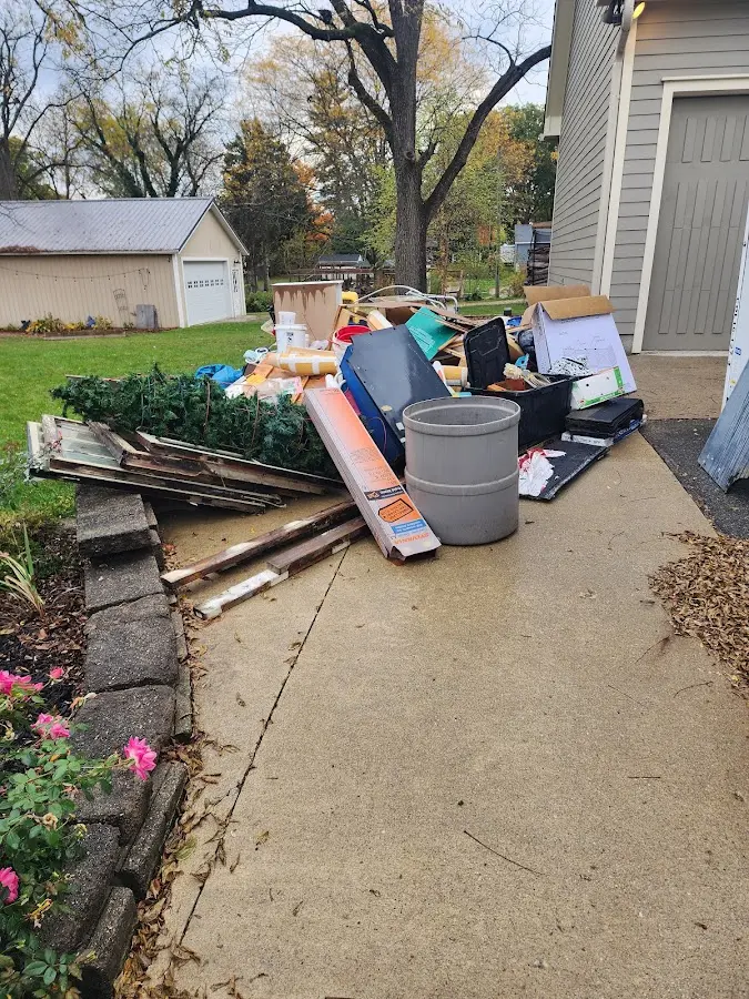 Dumpster being loaded with debris for Commercial Dumpster Rental in Caddo Mills